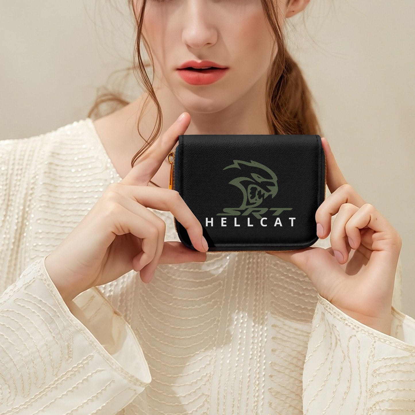 Person holding a black wallet with 'HELLCAT' branding